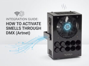 Text reads 'Integration Guide: How to Activate Smells Through DMX (ArtNet)'; a black scent-diffuser device with a blue-lit fan on the right and multiple circular ports on its front.